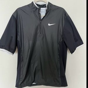 NEW. Men’s NIKE GOLF Medium Black Half Zip Pullover Jacket, windbreaker